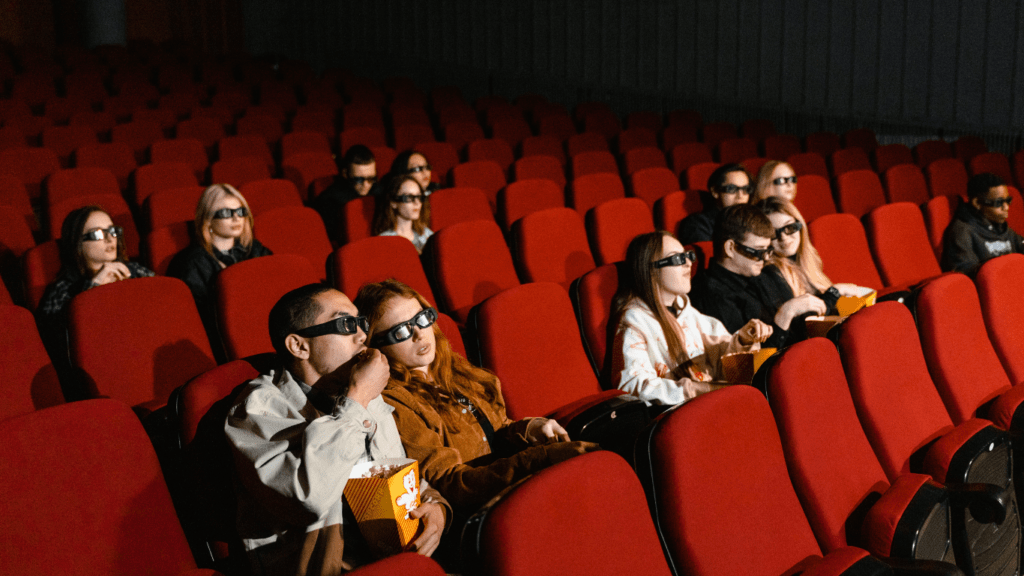 Group of people watching a film in movie theatre