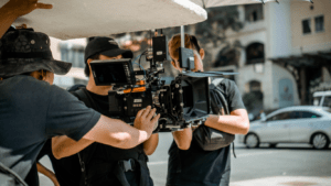 Three people taking charge with the film camera