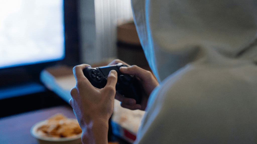 A man playing using gaming console