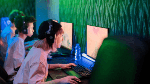 Group of players wearing headphones while playing video games