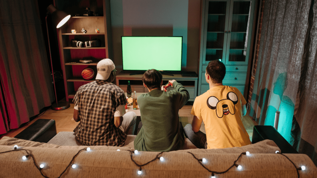 three people having fun playing video games