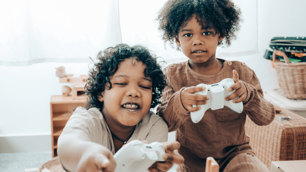 two kids playing with gaming console