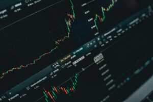 Close-up of stock market trading screen displaying financial growth and charts.